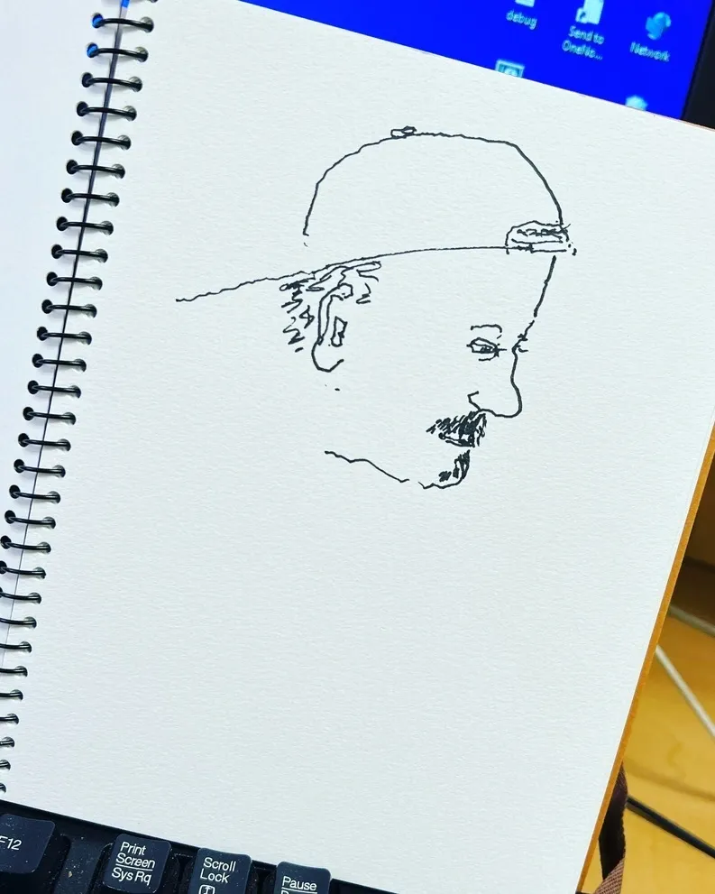 A drawing of a man with a hat on.